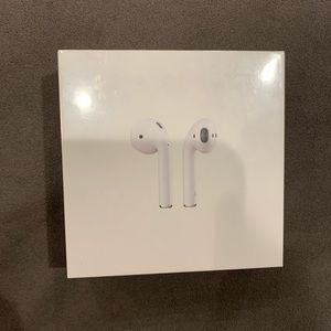 BRAND NEW AIRPODS WITH WIRELESS CHARGING CASE.